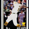 Topps 1995 baseball trading card featuring Nick Kurtz of the Oakland Athletics, shown in a batting pose wearing a white uniform with gold and black accents.